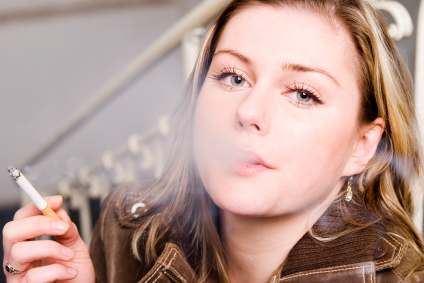 A woman smoking a cigarette.